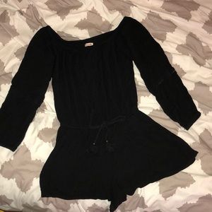 a black off the shoulder romper